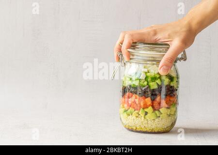Vegetables salad in a jar. Copy space. Vegetarian food, lunch, dinner Stock Photo