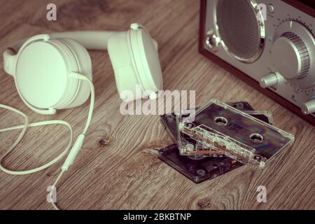 Cassette tapes, music player with white headphones. Retro style Stock Photo