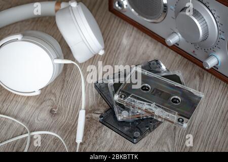 Cassette tapes, music player with white headphones. Retro style Stock Photo