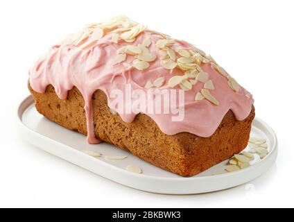 sweet bread decorated with melted raspberry white chocolate and almonds isolated on white background Stock Photo