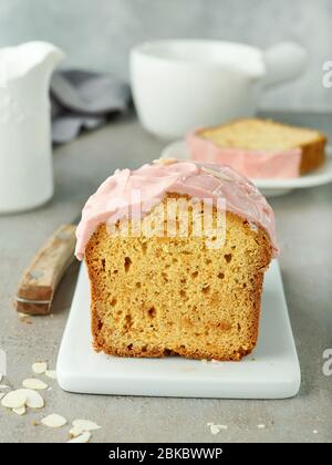 freshly baked sweet bread with pink chocolate on grey table Stock Photo
