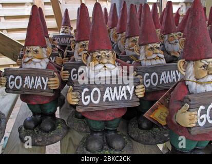 Go Away Xmas gnomes, garden centre antisocial attitude Stock Photo