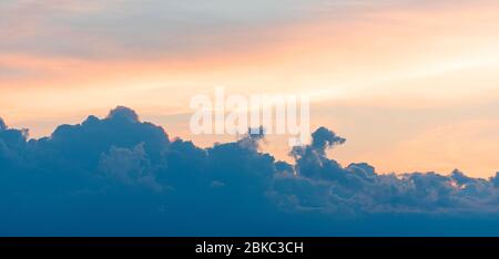 Sky during sunset with dark clouds, nature background, high resolution Stock Photo