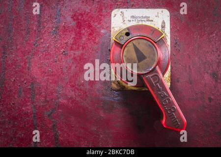 mains switch of a historic machine Stock Photo