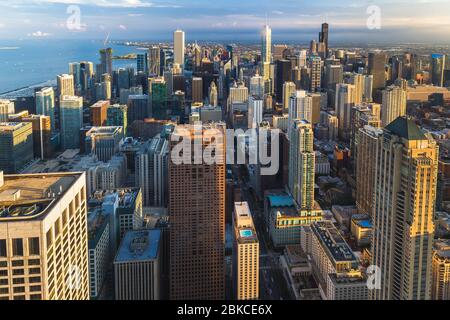 Chicago skyline panorama aerial view with skyscrapers over Lake Michigan with cloudy sky at dusk. Stock Photo