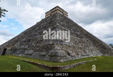 Kukulcan Temple on a cloudy day. The Kukulcan temple, also called the Castle, dominates the Chichen Itza archaeological site. Stock Photo