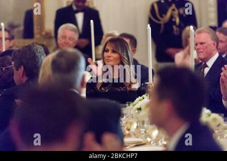 First Lady Melania Trump listens to President Donald J. Trump give remarks during a dinner in celebration of evangelical leadership in the State Dining Room of the White House | August 27, 2018 The Evangelical Leadership Dinner Stock Photo