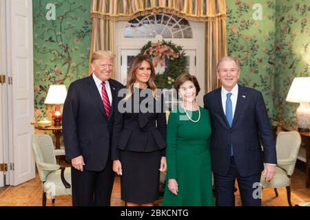 President Donald J. Trump and First Lady Melania Trump visit with former President George W. Bush and former First Lady Mrs. Laura Bush Tuesday, December 4, 2018, at the Blair House in Washington, D.C. President Donald J. Trump and First Lady Melania Trump with former President George W. Bush and former First Lady Laura Bush Stock Photo