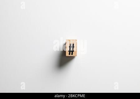 ' hashtag sign ' text made of wooden cube on  White background with clipping path. Stock Photo