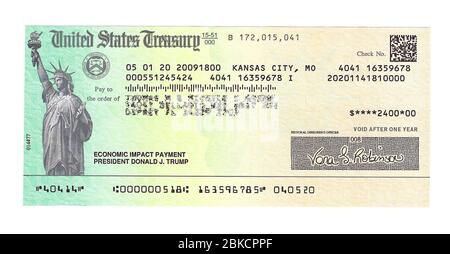 This is a close-up of an actual check for $2400.00 issued by the United States Treasury to a married couple in payment for the negative economic impact to residents of the U.S. caused by the novel coronavirus disease commonly known as COVID-19. The American Congress voted in early 2020 to make a one-time payment of $1,200.00 to every eligible adult as part of the government’s economic relief package to stave off the effects of the coronavirus pandemic. Unprecedented and controversial was the decision by the Treasury Department to print 'President Donald J. Trump' on each check .