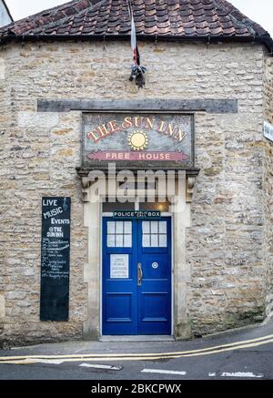 Police Box - Tardis - blue door entrance to The Sun Inn in Frome, Somerset, UK on 3 May 2020 Stock Photo
