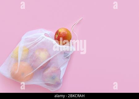 reusable bag for shopping products on a pink background.. zero waste concept View from above Stock Photo