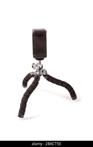 Adjustable universal smart phone tripod for remote recording and podcast isolated on the white background Stock Photo