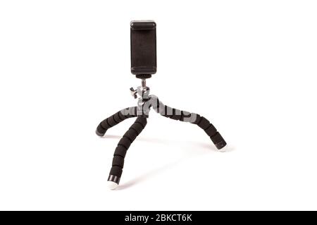 Adjustable universal smart phone tripod for remote recording and podcast isolated on the white background Stock Photo