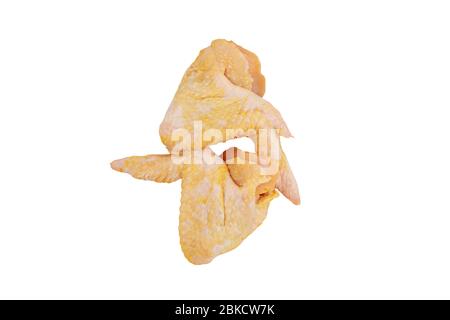 Raw yellow corn fed chicken wings isolated on white. Stock Photo
