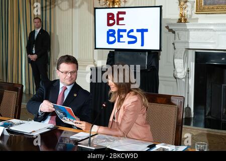 First Lady Melania Trump talks with Matt Dummermuth, Principal Deputy Assistant Attorney General, United States Department of Justice during The First Lady's Interagency Working Group on Youth Programs on Monday, March 18, 2019, in the State Dining Room of the White House in Washington, D.C. The Interagency Working Group on Youth Programs Stock Photo