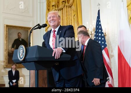 President Donald J. Trump, accompanied by First Lady Melania Trump, Polish President Andrzej Duda, and his wife Mrs. Agata Kornhauser-Duda, delivers remarks at a Polish-American Reception Wednesday, June 12, 2019, in the East Room of the White House. President Trump's Remarks at a Polish-American Reception Stock Photo
