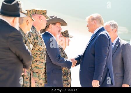 President Donald J. Trump, joined by newly named White House National Security Advisor Robert C. O’Brien, is greeted by Mayor Steven Vaus of Poway, Calif., and military personnel on his arrival to Marine Corps Air Station Miramar Wednesday, Sept. 18, 2019, in San Diego, Calif. President Trump in California Stock Photo