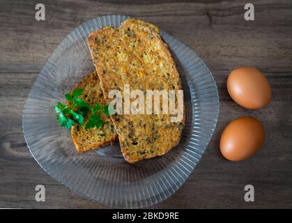 Sliced bread covered eggs (Yumurtali ekmek) for breakfast Stock Photo