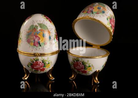 Jewelery Faberge eggs on a black table and a black background Stock Photo