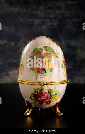 Jewelery Faberge egg on a dark table Stock Photo