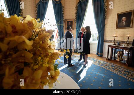 President Donald J. Trump and First Lady Melania Trump talk with Nationals General Manager Mike Rizzo and Manager Dave Martinez in the Blue Room of the White House Monday, Nov. 4, 2019, following the celebration of the 2019 World Series Champions, the Washington Nationals on the South Lawn. President Trump Welcomes the Washington Nationals to the White House Stock Photo