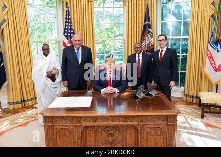 President Donald J. Trump, joined by Secretary of the Treasury Steven Mnuchin, meets with the Minister of Foreign Affairs of the Republic of Sudan Asma Mohamed Abdalla, left, the Minister of Foreign Affairs of the Republic of Egypt Sameh Shoukry, and the Minister of Foreign Affairs of the Federal Democratic Republic of Ethiopia Gedu Andargachew, in the Oval Office of the White House Wednesday, Nov. 6, 2019, where President Trump expressed his support for Egypt, Ethiopia, and Sudan’s ongoing negotiations to reach a collaborative agreement on the Grand Ethiopian Renaissance Dam. Grand Ethiopian Stock Photo