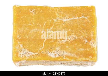 piece of wet laundry soap and sud isolated on white Stock Photo