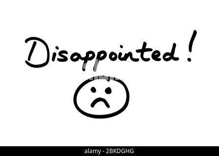 Disappointed handwritten on a white background with a doodble of a sad face. Stock Photo