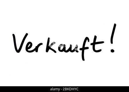 The word Verkauft! - meaning Sold! in the German language, handwritten on a white background. Stock Photo