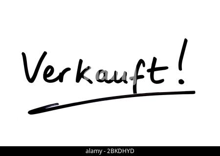 The word Verkauft! - meaning Sold! in the German language, handwritten on a white background. Stock Photo