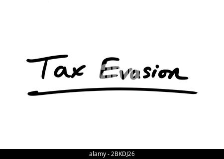Tax Evasion handwritten on a white background. Stock Photo