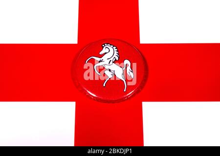 A badge portraying the flag of the English county of Kent pictured over the England flag. Stock Photo