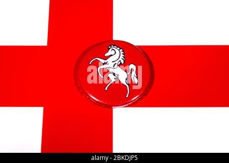 A badge portraying the flag of the English county of Kent pictured over the England flag. Stock Photo