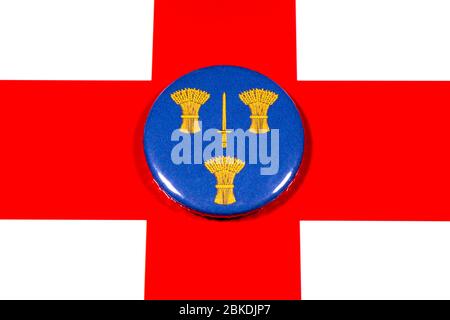 A badge portraying the flag of the English county of Cheshire pictured over the England flag. Stock Photo