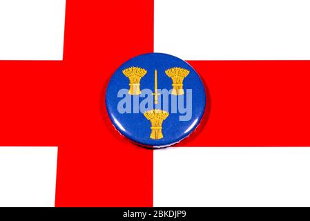A badge portraying the flag of the English county of Cheshire pictured over the England flag. Stock Photo