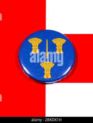 A badge portraying the flag of the English county of Cheshire pictured over the England flag. Stock Photo