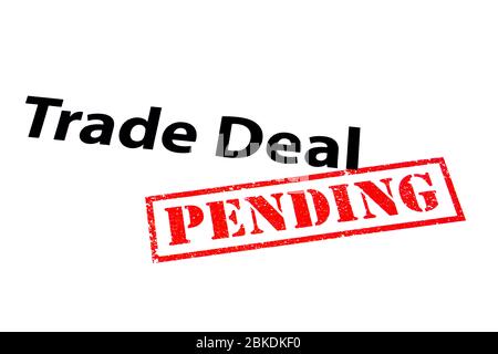 Trade Deal heading with a red PENDING rubber stamp. Stock Photo