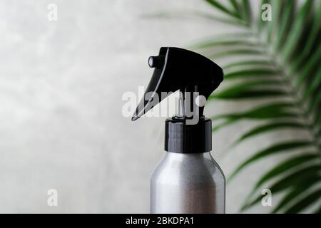 Silver cosmetic trigger sprayer bottle mockup, close-up view Stock Photo