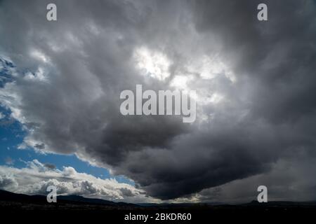 Dark and Dramatic Storm Clouds Area Background Stock Photo