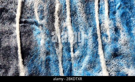 Merino wool being wet felted with sudsy water for a garment by textile artist Michelle Reid Stock Photo