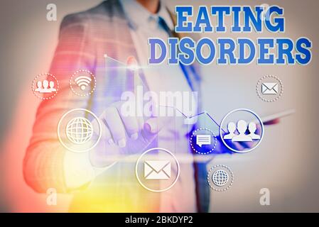 Handwriting text writing Eating Disorders. Conceptual photo any of a range of psychological abnormal food habits Stock Photo