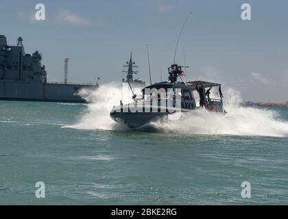 GULF OF TADJOURA, Djibouti - U.S. Navy sailors assigned to Coastal Riverine Squadron TEN FORWARD, forward-deployed to Camp Lemonnier, Djibouti, conduct hard turns on a 34-foot patrol boat while on patrol near the Port of Djibouti, April 18, 2020. Combined Task Group 68.6/CRS-TEN FORWARD is responsible for planning and execution of expeditionary missions in the U.S. 6th Fleet area of responsibility. Camp Lemonnier is an operational installation that enables U.S., allied and partner nation forces to be where and when they are needed to ensure security in Europe, Africa and Southwest Asia. (U.S. Stock Photo