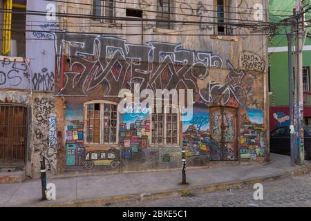 Colored graffiti, street art on the walls of Valparaiso, Chile Stock Photo