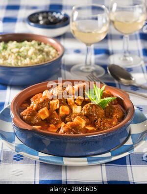 Keftedes saganaki with orzo. Meatballs in tomato and feta sauce. Greece Food Stock Photo