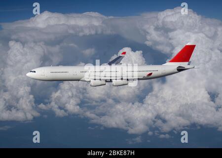 Air travel. Long haul passenger jet plane flying in the air at high altitude against a cloudy sky on a commercial flight. Airplanes and flights. Stock Photo