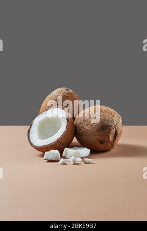 Fruit set from natural exotic coconuts on a duotone background. Stock Photo