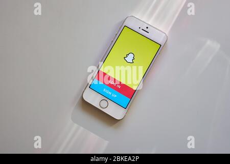 Snapchat mobile app login page is seen on a smartphone. Snapchat is a multimedia messaging app used globally, developed by Snap Inc. Stock Photo