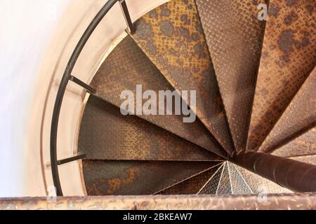 Metal spiral staircase in the old building Stock Photo