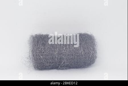 One piece of fine steel wool isolated on white background Stock Photo